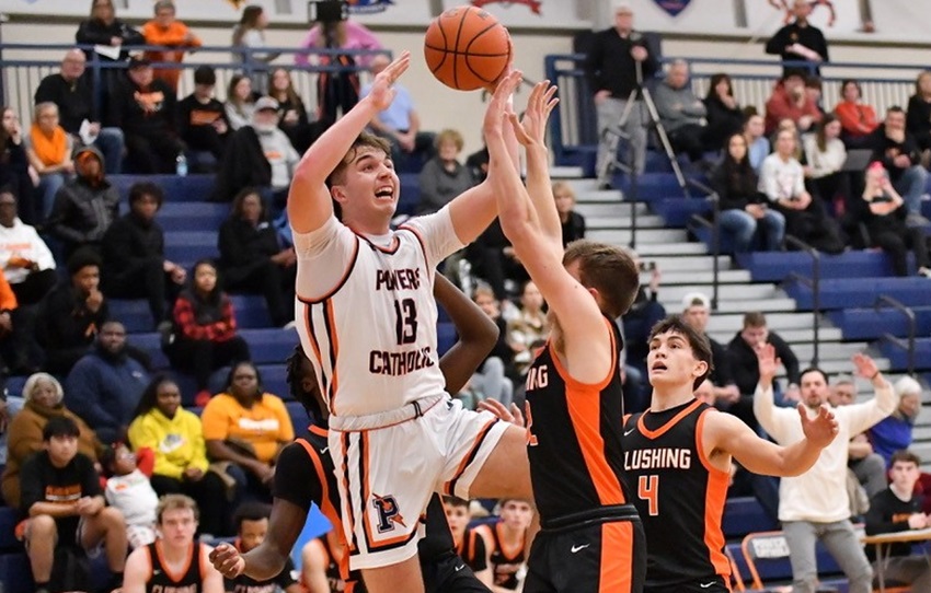 Flint Powers Catholic’s Jesse Cull (13) gets up a shot during his team’s 69-59 win over Flushing on Tuesday. 