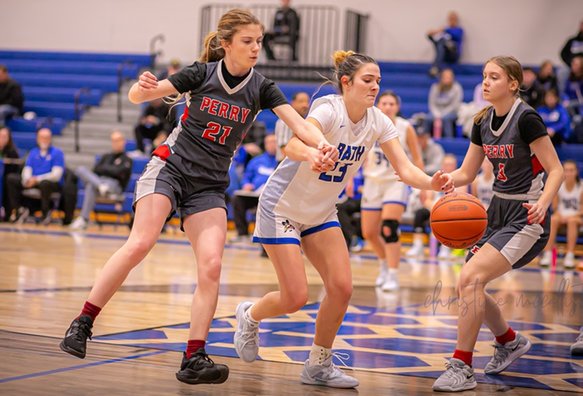 Perry's Abigail Cochrane (21) and Bath's Jordyn Lira (23) chase after a loose ball during the Bees' 54-24 win Thursday.