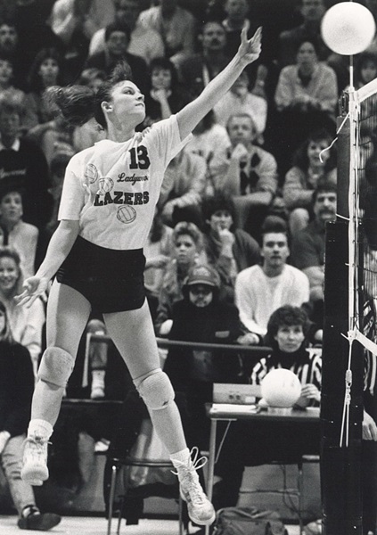 Livonia Ladywood's Jenny Belcher tips the ball during her team's 1988 Class A Semifinal win over Lake Orion.