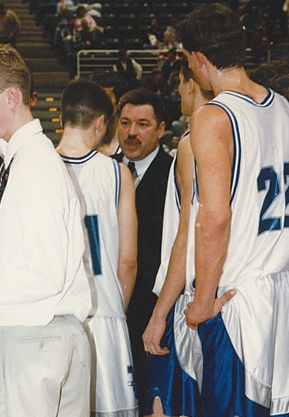 Keeler, middle, huddles with his team during the 1997 run to Breslin, when the Defenders finished Class D runners-up.