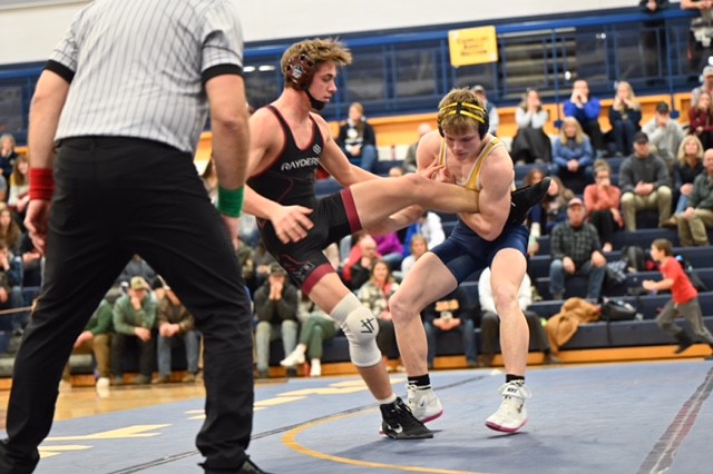 The Vikings' Payton Sampson works toward a takedown in his match against the Rayders.