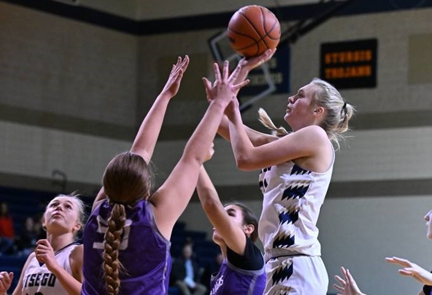 An Otsego player gets up a shot in the lane during her team’s win over Three Rivers on Dec. 19. 