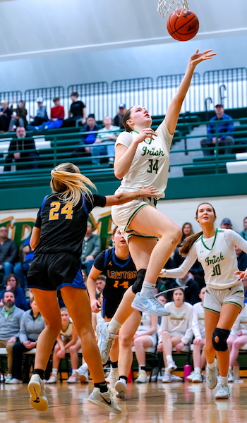 Young (34) gets to the basket against Lawton. 