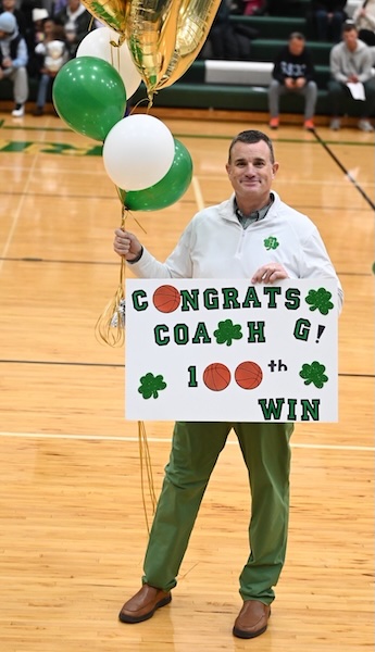 Gallagher is celebrated on-court after his 100th win.