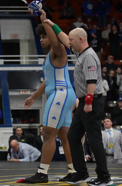 The Shamrocks' Benny Eziuka has his hand raised in victory after his match at 285.