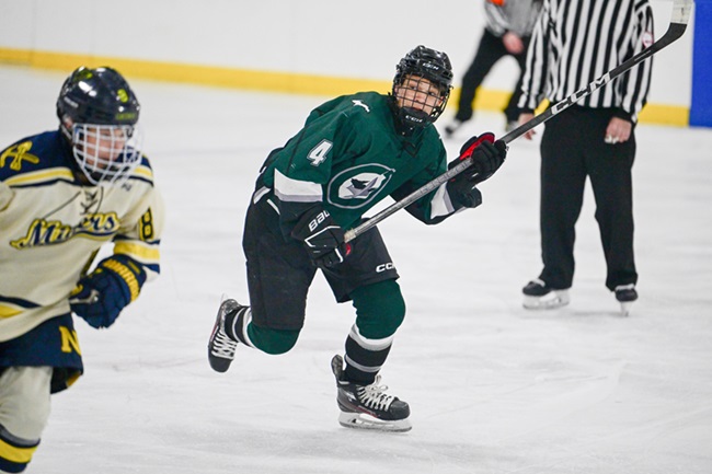 The Jets’ Easton Therrian (4) makes his way up ice against Negaunee.