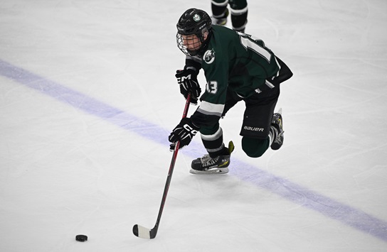 Brit Heinonen advances past the blue line.