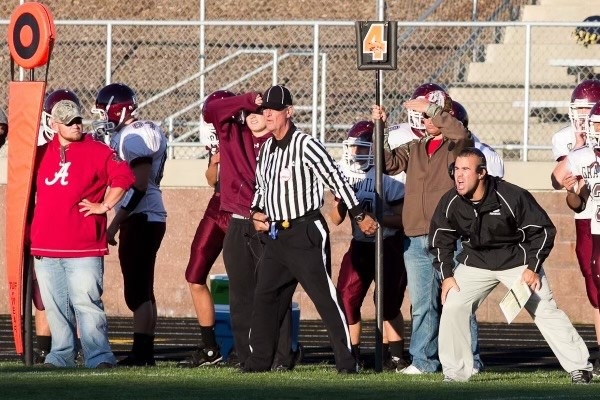 Mike VanderVelde officiates a Grandville High school game.