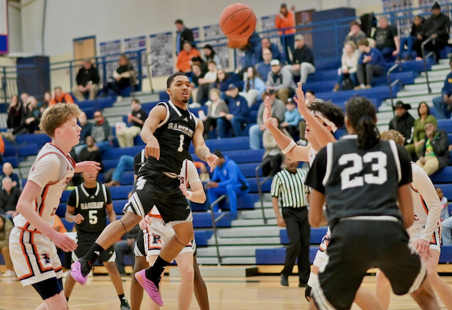 Saginaw United’s Lemonte Ramon-Wiley (1) finds a teammate during an 81-78 win over Flint Powers Catholic on Friday.